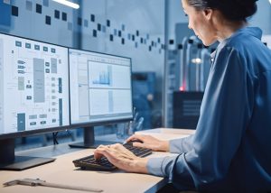 A woman analyzing data on a computer